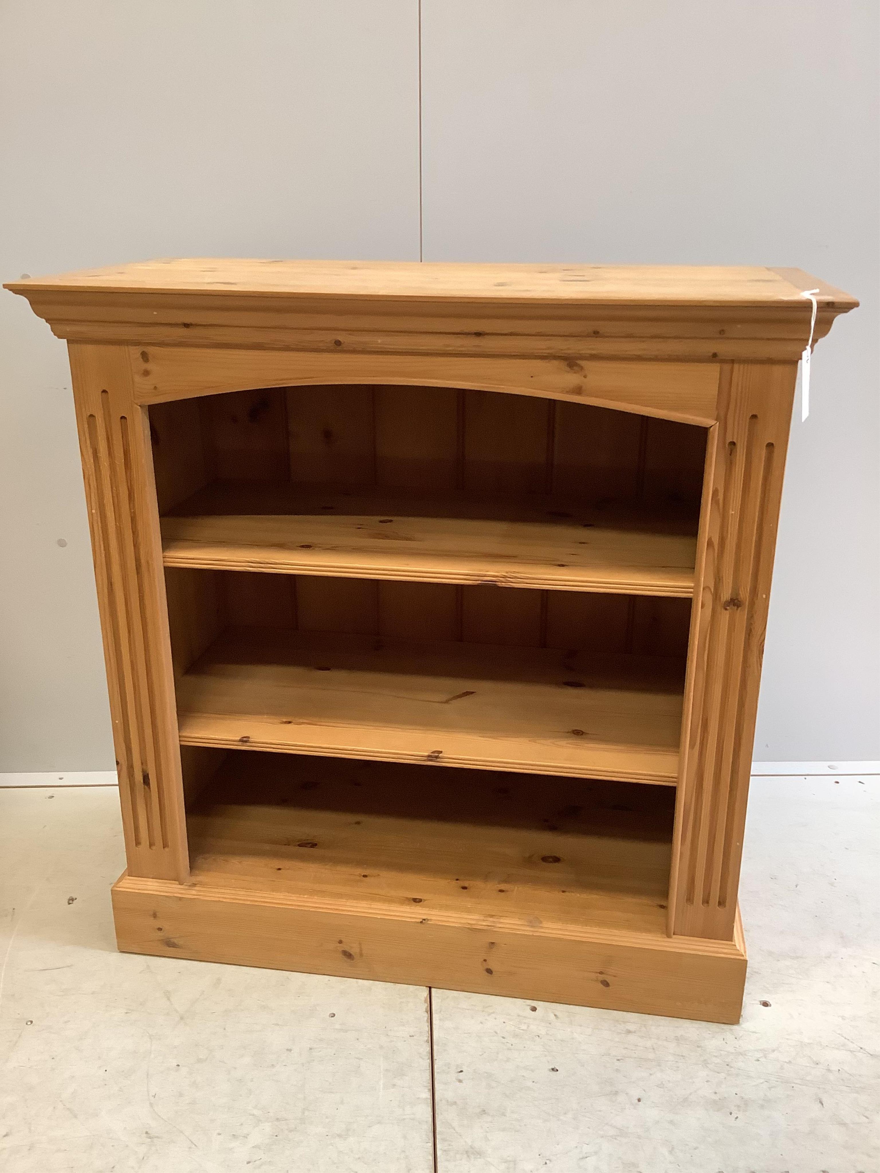 Two reproduction pine open bookcases, larger width 91cm, depth 44cm, height 92cm. Condition - fair